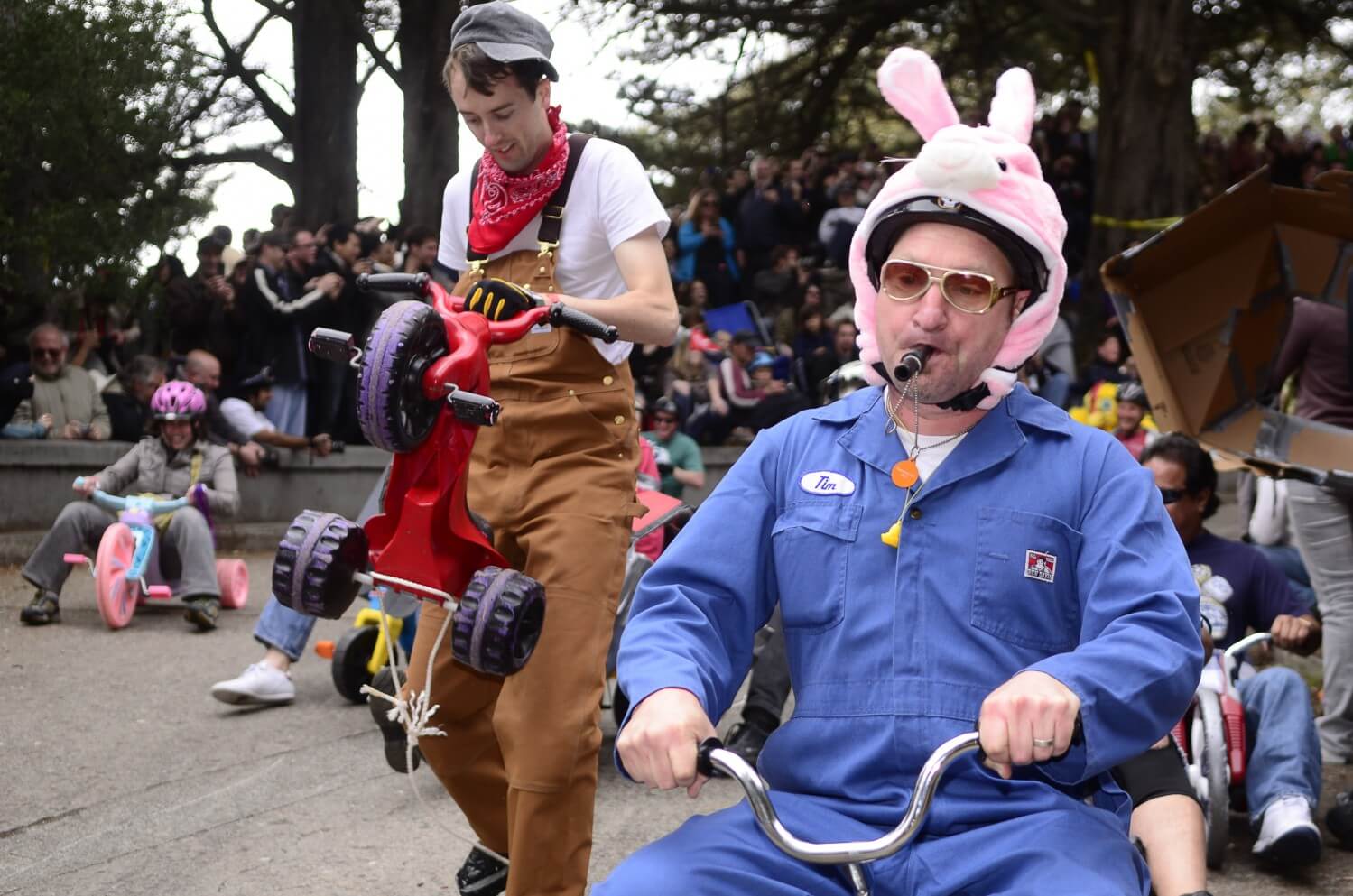 Adult participants go barreling down Vermont Street at the Bring Your Own Big Wheel race in Potrero Hill, April 8, 2012