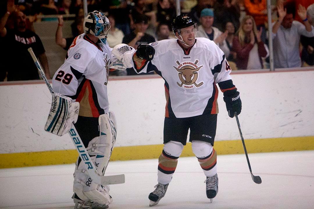 The Bulls' Justin Bowers (41), right, celebrates after scoring the SF Bulls first goal with Goalie Taylor Nelson (29) as the SF Bulls faced off against the Stockton Thunder in the inaugural preseason hockey game at the Cow Palace in San Francisco, Calif
