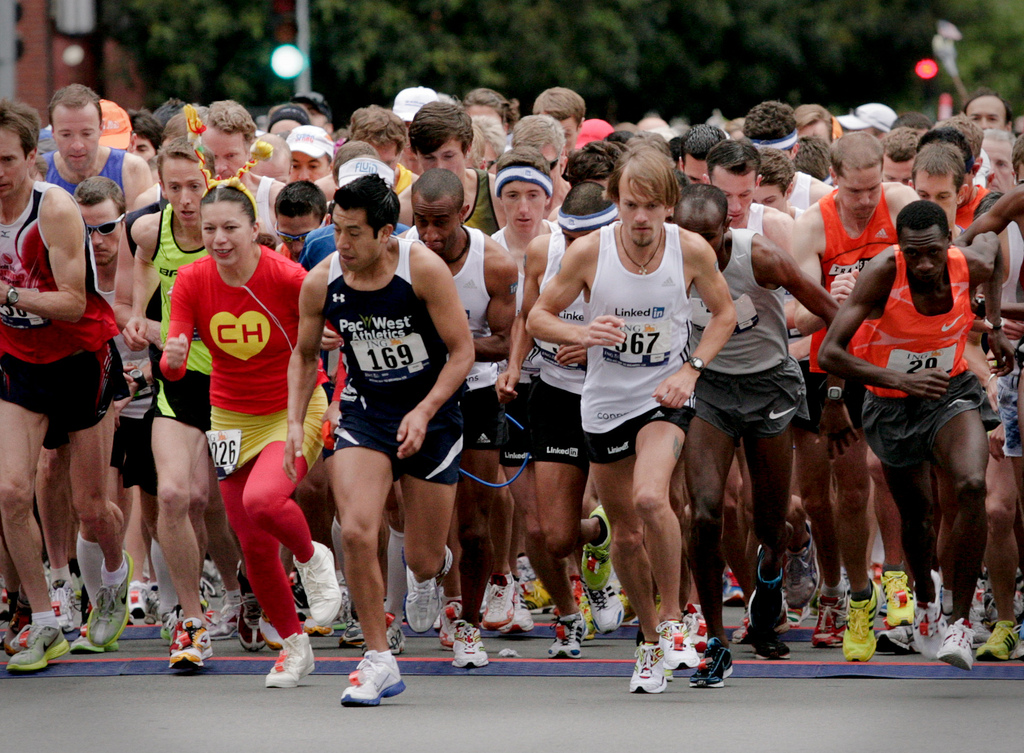 Participants run in The City's famous Bay to Breakers, which is now scrambling to find a new sponsor. (smi23le/Flickr)