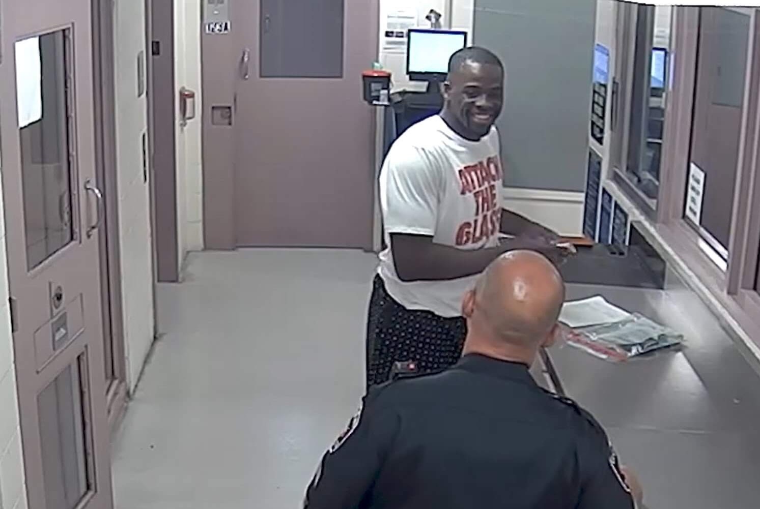 Draymond Green uses cellphone, jokes with officers in booking video